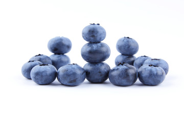 Blueberries on white background, blueberry berries isolated, blue berries close-up, blank for designer, vegetarian food for breakfast, blue fruits for smoothies