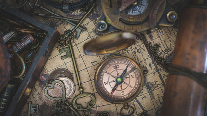 Fototapeta na wymiar Vintage Compass On Old World Map