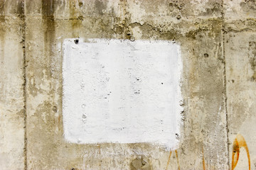 old wall with a white square in the middle