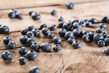 Fresh blueberries on wooden table.
