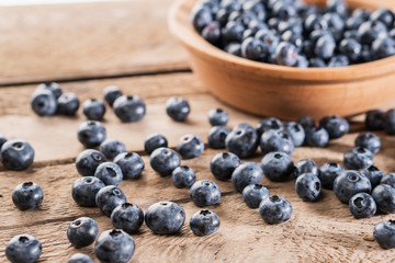 Fresh blueberries on wooden table.
