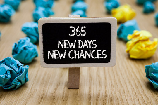 Text sign showing 365 New Days New Chances. Conceptual photo Starting another year Calendar Opportunities Paperclip hold written chalkboard behind paper lumps on woody deck.