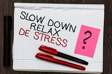 Word writing text Slow Down Relax De Stress. Business concept for Have a break reduce stress levels rest calm Color pen on written notepad with question mark black marker on woody deck.
