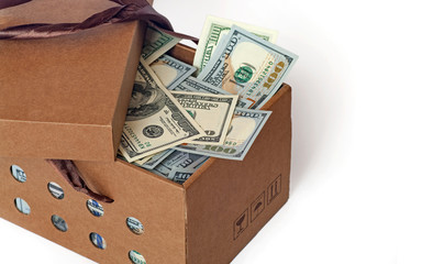 Cardboard box full of dollars.