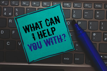 Text sign showing What Can I Help You With question. Conceptual photo Offering assistance Experts advice ideas Huge button with computer keyboard black lined written blue page marker pen.