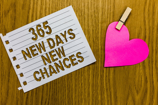 Conceptual hand writing showing 365 New Days New Chances. Business photo showcasing Starting another year Calendar Opportunities Yellow woody deck word with white page paper clip grip heart.