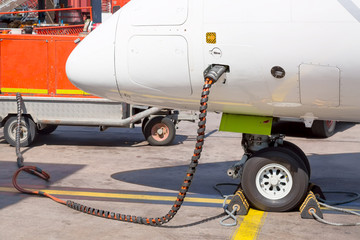 Refueling the aircraft. Tanking small airplane outdoors. Transportation concept.