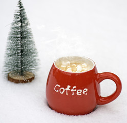 red ceramic mug with hot coffee and marshmallow