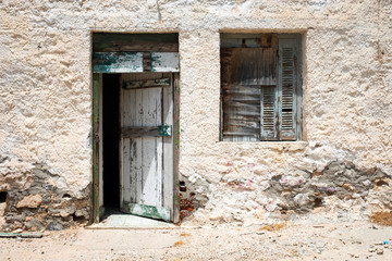 Old vintage wooden open door in abandoned building