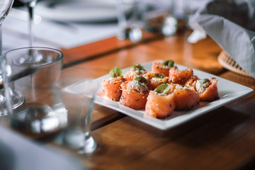 Finger food. Rolls of salmon with cream cheese.