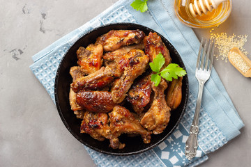 Grilled chicken teriyaki on grey stone background.