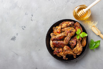 Grilled chicken teriyaki on grey stone background.