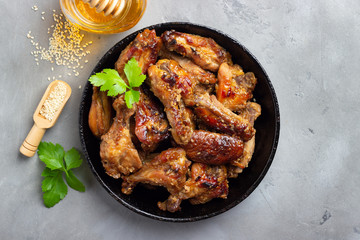 Grilled chicken teriyaki on grey stone background.