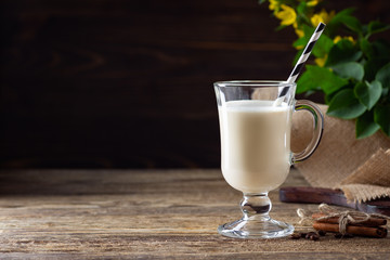 Tasty cocktail on a wooden table. Copy space.