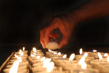 Lighting church candles
