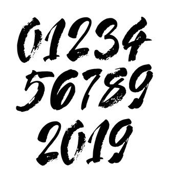 set of calligraphic acrylic or ink numbers. ABC for your design, brush lettering on a black background