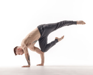 Naklejka premium Young beautiful dancer is posing in studio