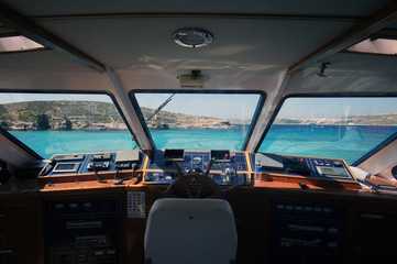 Inside view on the boat cockpit on the Blue Lagoon, Comino, Malta