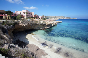 Fototapeta na wymiar Abandoned hotel next to the beach on Comino (Kemmuna) Island, Malta