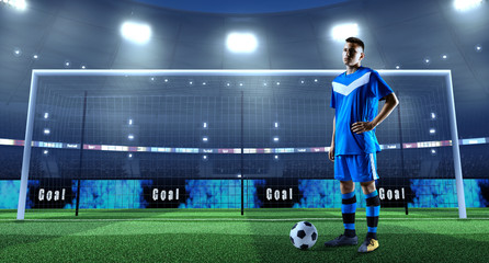 Young soccer player with ball in front of the goal on a professional 3D stadium