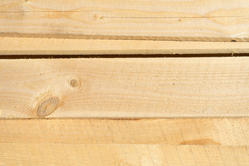 Rough sawn Scots pine boards stack on the construction site