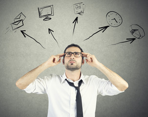 Stressed businessman tries to plan his work day