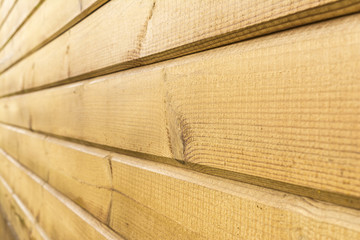 wall of yellow wooden panels, perspective view, abstract background
