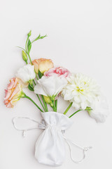 Obraz na płótnie Canvas Bouquet of flowers in gentle tones, top view