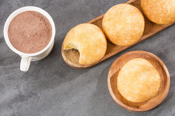 Almojabana, traditional Colombian food - Drink of chocolate. Top view