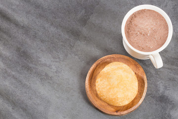 Almojabana, traditional Colombian food - Drink of chocolate. Top view