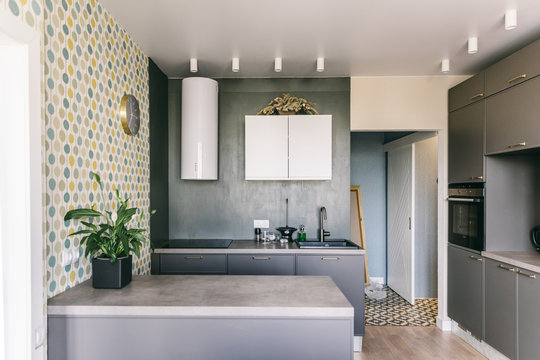 Scandinavian interior design. White grey wooden kitchen room organization