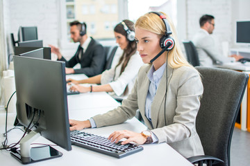 Business woman working in call center as an operator or customer service staff
