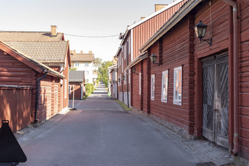 Fototapeta na wymiar Red timbered houses in Sater in Sweden