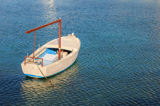 Small fishing boat in the blue Adriatic sea