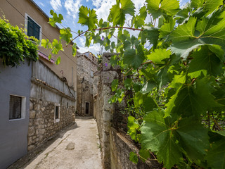 The narrow street of Mediterranean town of Trpanj on Peljesac peninsula, Croatia