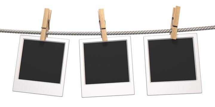 Clothes pin and three blank photo papers hanging on rope 3D
