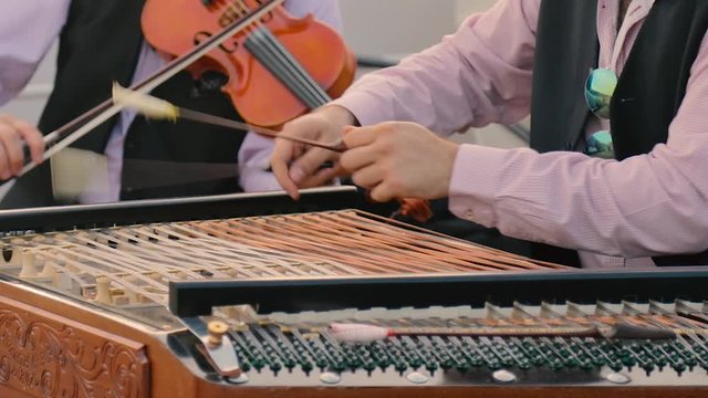 Close up of HANDS playing a CIMBALON in BUDAPEST, HUNGARY