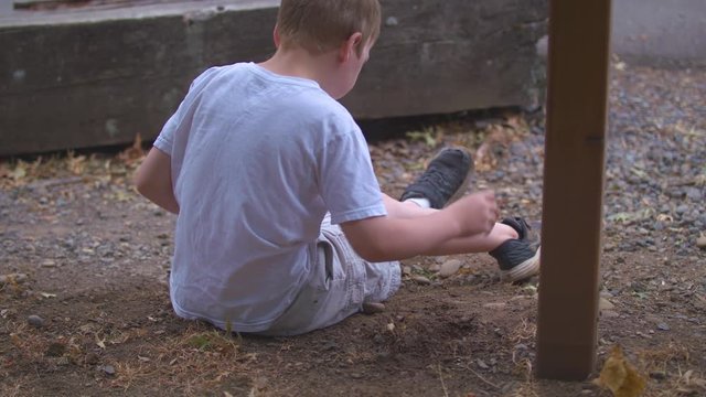 A child playing in the dirt on a sunny day.  Shot on a Blackmagic Ursa Mini Pro 4.6k with a Sigma 50-100mm f/1.8.