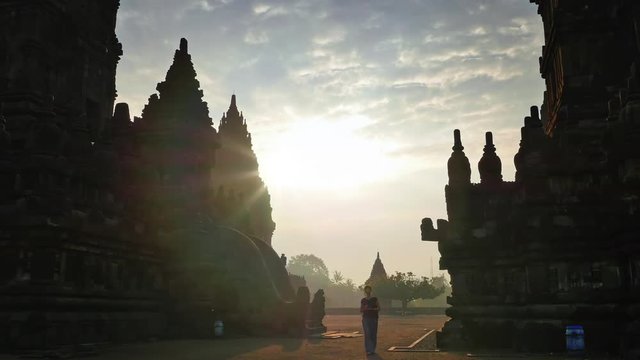 Tourist visiting Prambanan temple in Java Indonesia. Travel destination landmark