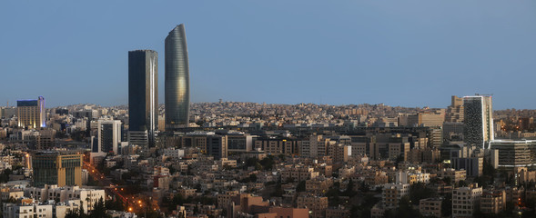the new downtown of Amman abdali area - View of modern buildings in Amman at night - obrazy, fototapety, plakaty