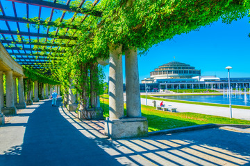 An arcade covered with plants circulating fountain at Stulecia hall in Wroclaw, Poland