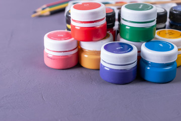 Colorful vibrant cans of gouache. Set for children's creativity