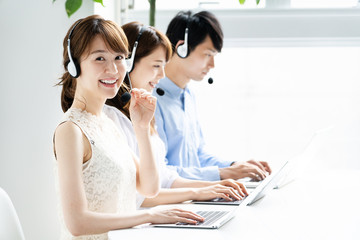 asian operator working in office