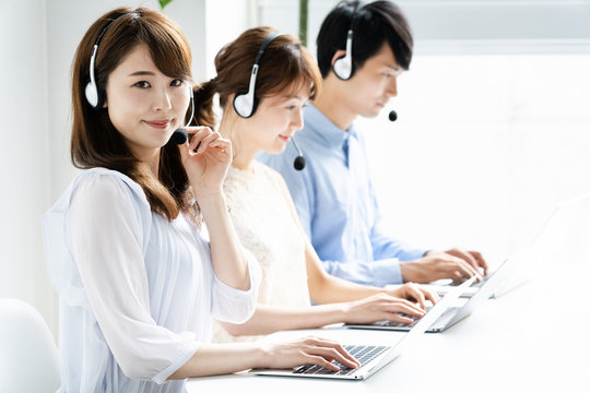 asian operator working in office