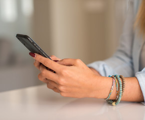 Woman using smartphone at home