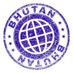BHUTAN stamp imprint with distress texture. Blue vector rubber seal imprint of BHUTAN tag with retro texture. Seal has words placed by circle and globe symbol.