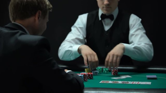 Lucky poker player throwing one pair of aces on table, good combination, winner
