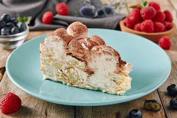 Italian Homemade Tiramisu Cheesecake on Vintage Background