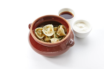Dumplings known as Pelmeni, Gyoza, Dim Sum, Jiaozi, Momo, Tortellini, Pierogi, Varenyky, Mandu or...