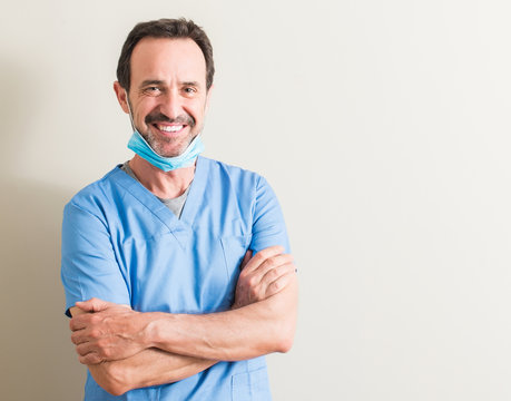 Senior Doctor Man Using Mask With A Happy Face Standing And Smiling With A Confident Smile Showing Teeth